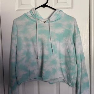 a cropped aqua blue and white hoodie.